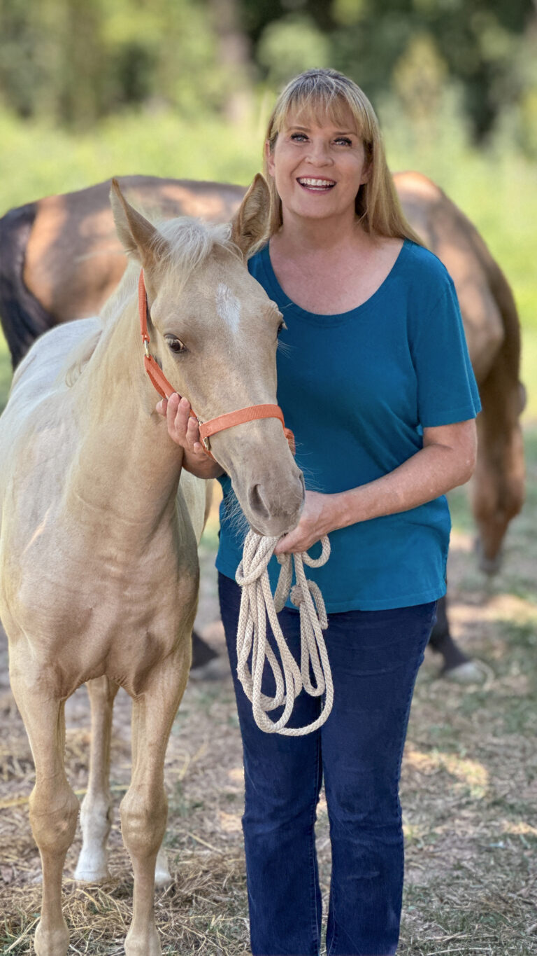 Cheryl Barton with four month old Horse Tawny