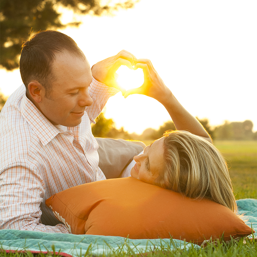 30s; Copy Space; Wedding; adult; affectionate; anniversary; arm around; arm in arm; back lit; bonding; couple; embracing; engagement; heterosexual couple; holding; holding hands; honeymoon; husband; lifestyle; love; married; meadow; newlywed; orange; outdoors; relationship; sharing; side view; silhouette; sky; standing; sunset; talking; togetherness; touching; two adults; two people; unity; wife